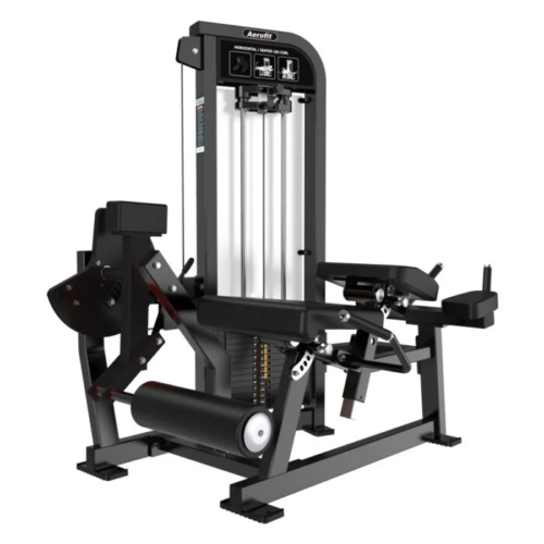 Aerofit prone leg curl and leg extension combo machine with selectorized weight stack, adjustable seat and backrest, padded ankle rollers, and heavy-duty frame for commercial gym leg training.